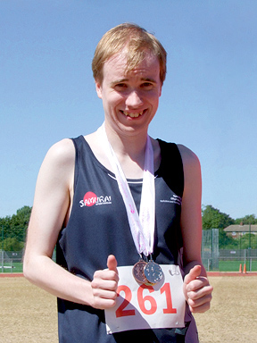 Oliver with his medals