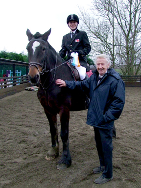 Oliver and Bailey receiving their award from Bernard Atha CBE
