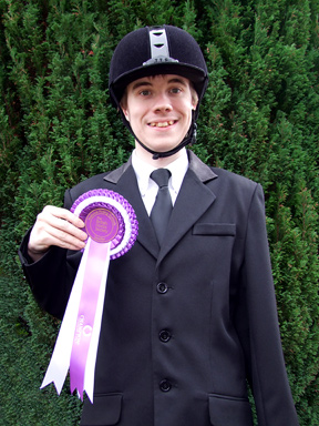 Oliver with his qualifier rosette