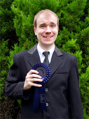 Oliver with his qualifier rosette