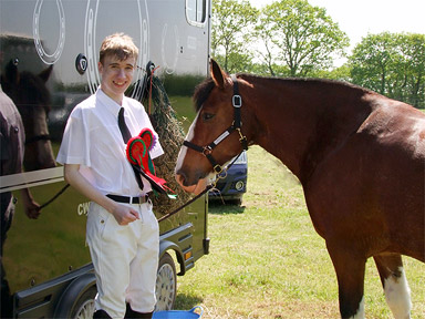 Oliver and Amber with their rosettes