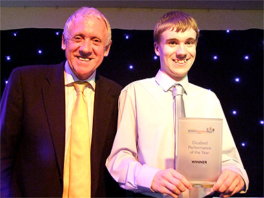 Oliver is presented with his award