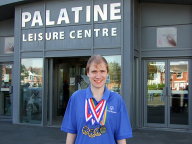 Oliver, breaststroke triple gold medallist