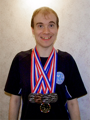 Oliver with his prize medals