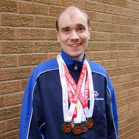 Oliver with his medals