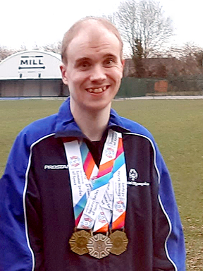 Oliver with his medals