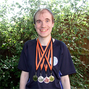 Oliver with his prize medals