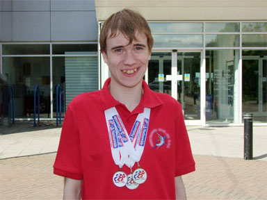 Oliver with his medals