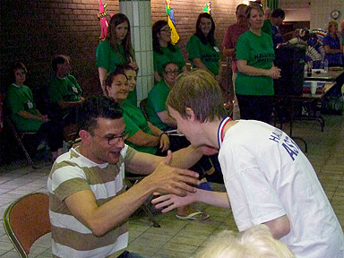 Oliver receiving his medals