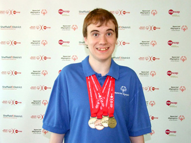 Oliver with his medals